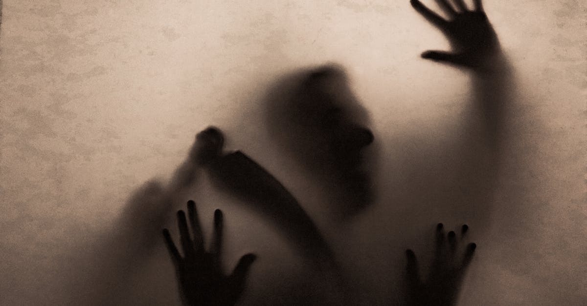 Shadowy figure holding a scythe behind fabric, creating an eerie and mysterious atmosphere.